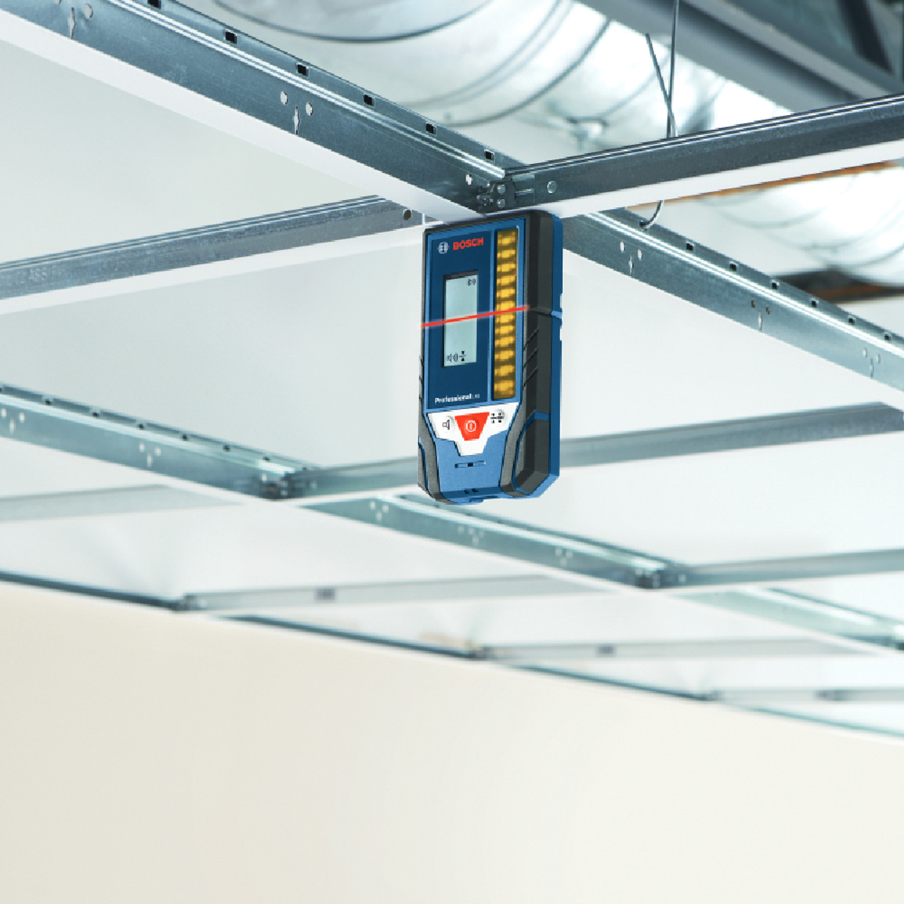 Bosch LR8 165 feet Red & Green Beam Line Laser Receiver showing in use reading laser horizontally to level suspended ceiling