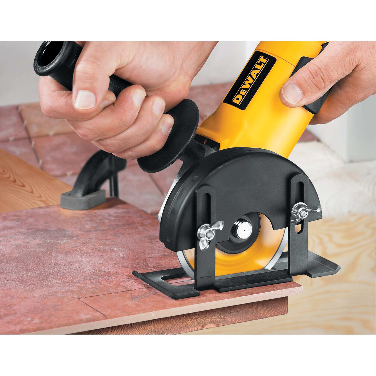 DeWalt DW4729 XP 4-1/2 inch Continuous Rim Tile Blade showing in use equipped on a angle grinder cutting tile DeWalt DW4729 XP 4-1/2 inch Continuous Rim Tile Blade showing in use equipped on a angle grinder cutting tile