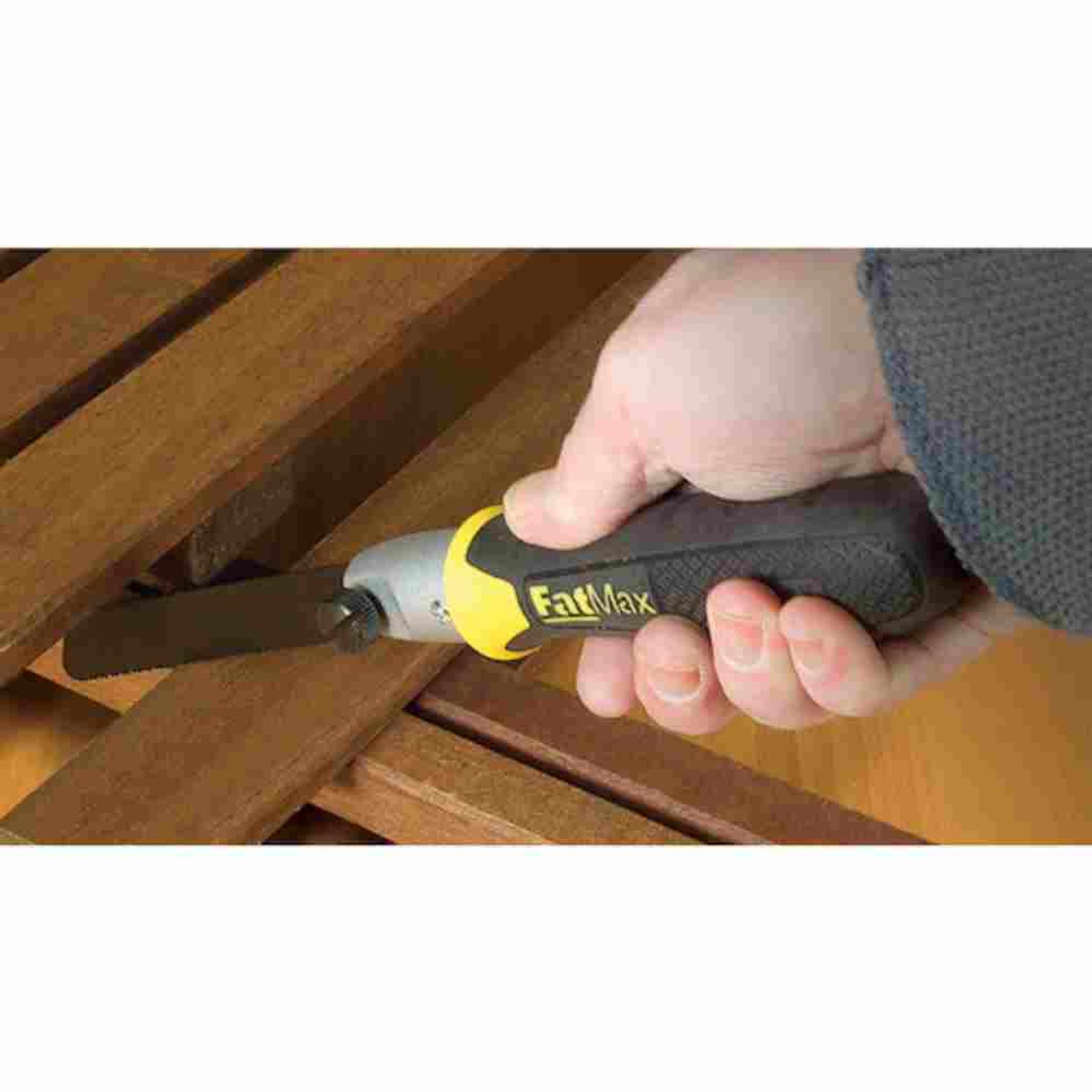 Stanley 20220 FATMAX 6 inch Multi Saw showing in use cutting wood trim in a confined area Stanley 20220 FATMAX 6 inch Multi Saw showing in use cutting wood trim in a confined area