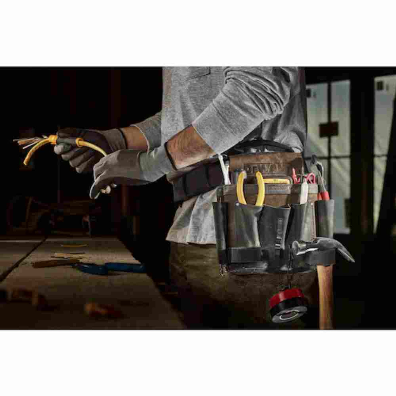 DeWalt DWST550115 Electrician Leather Tool Pouch showing with tools loaded in pouch mounted to a contractor foots belt(Tools sold separately)
