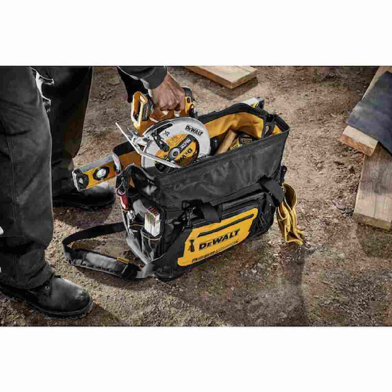 DeWalt DWST560104 20 inch Professional Open Mouth Tool Bag showing with tools loaded in bag on jobsite (Tools sold separately) DeWalt DWST560104 20 inch Professional Open Mouth Tool Bag showing with tools loaded in bag on jobsite (Tools sold separately)