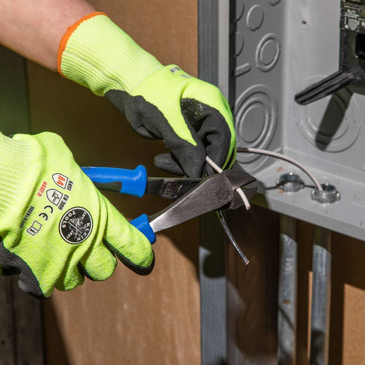 Klein Tools J2000-48 2000 Series 8 inch Angled-Head Diagonal-Cutting Pliers showing in use cutting wire Klein Tools J2000-48 2000 Series 8 inch Angled-Head Diagonal-Cutting Pliers showing in use cutting wire