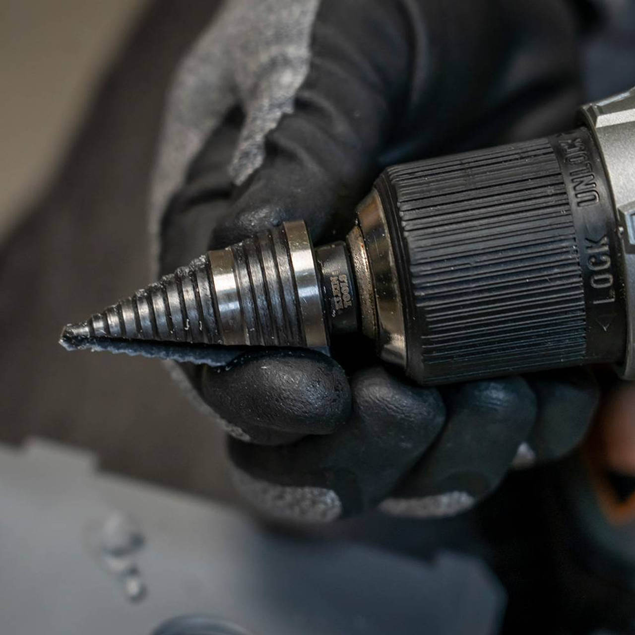 Klein Tools KTSB11 #11 2-Step 7/8 inch to 1-1/8 inch Double-Fluted High-Speed Step Drill Bit showing drill bit being changed Klein Tools KTSB11 #11 2-Step 7/8 inch to 1-1/8 inch Double-Fluted High-Speed Step Drill Bit showing drill bit being changed
