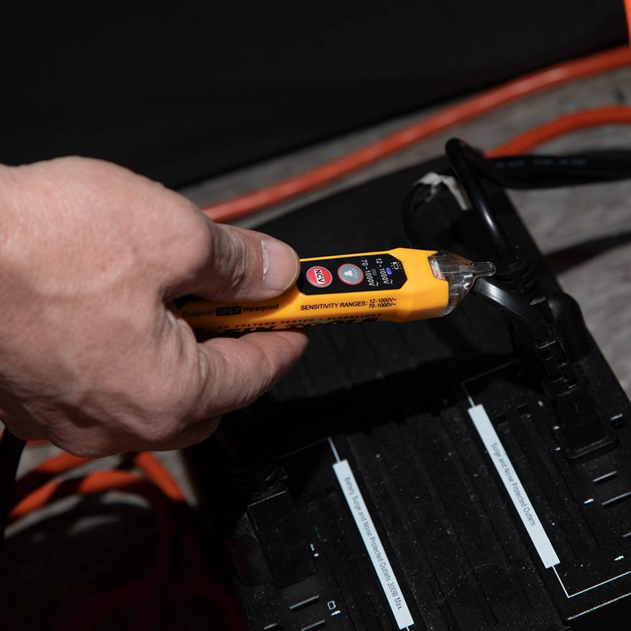 Klein Tools NCVT3P 12V to 1000V AC Dual Range Non-Contact Voltage Tester with Flashlight showing in use on exposed coated wires