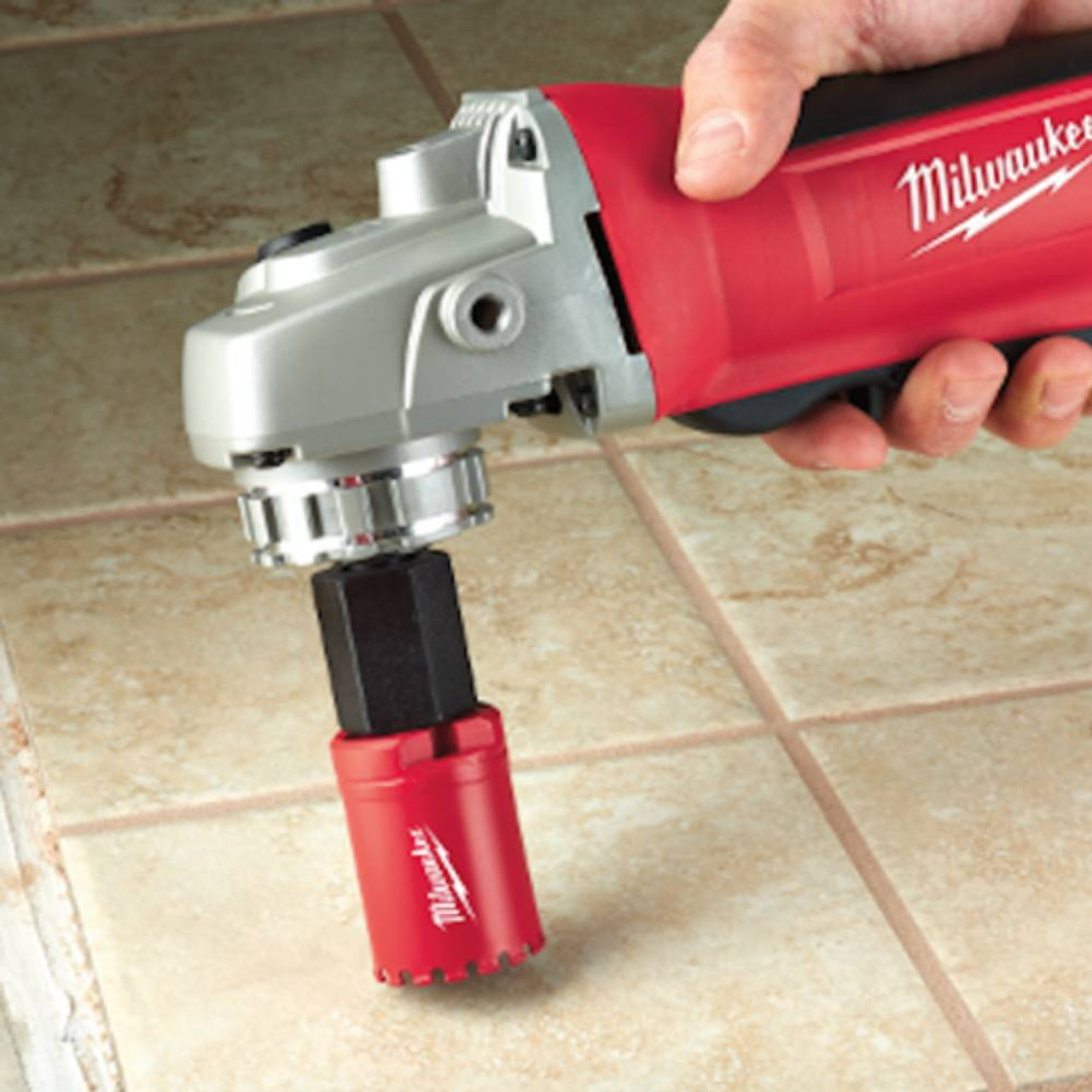 Milwaukee 49-56-7105 5/8-11 Angle Grinder Adapter showing in use drilling into tile Milwaukee 49-56-7105 5/8-11 Angle Grinder Adapter showing in use drilling into tile