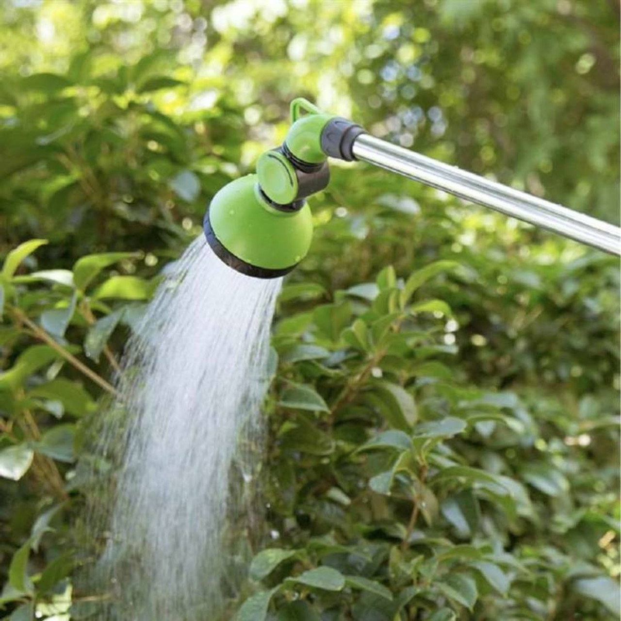 Holland Greenhouse N000705 35in - 51in Telescopic Watering Wand showing in use watering a shrub