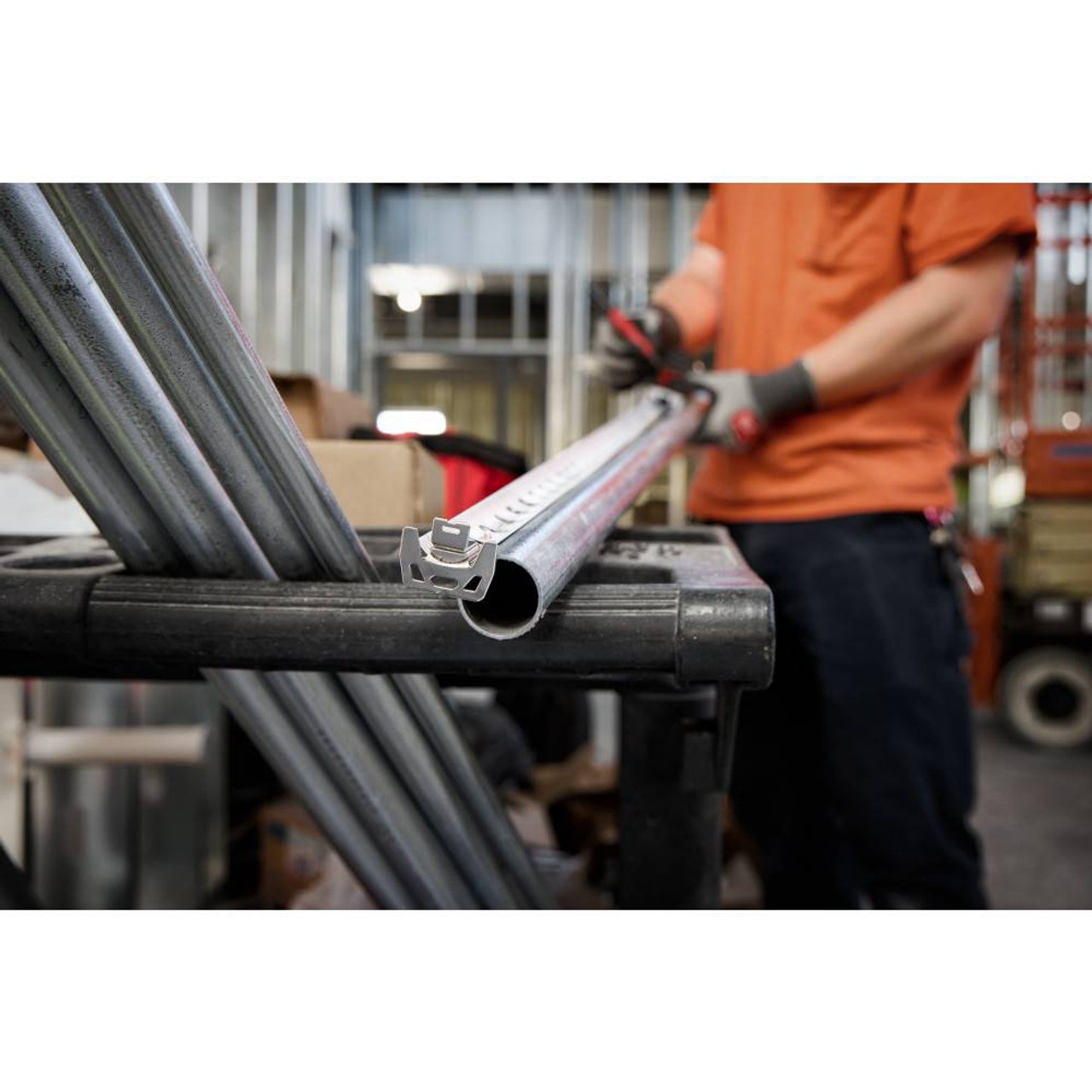 Milwaukee 48-22-1027M 25' Electrician's Magnetic Tape Measure showing in use measuring out conduit Milwaukee 48-22-1027M 25' Electrician's Magnetic Tape Measure showing in use measuring out conduit