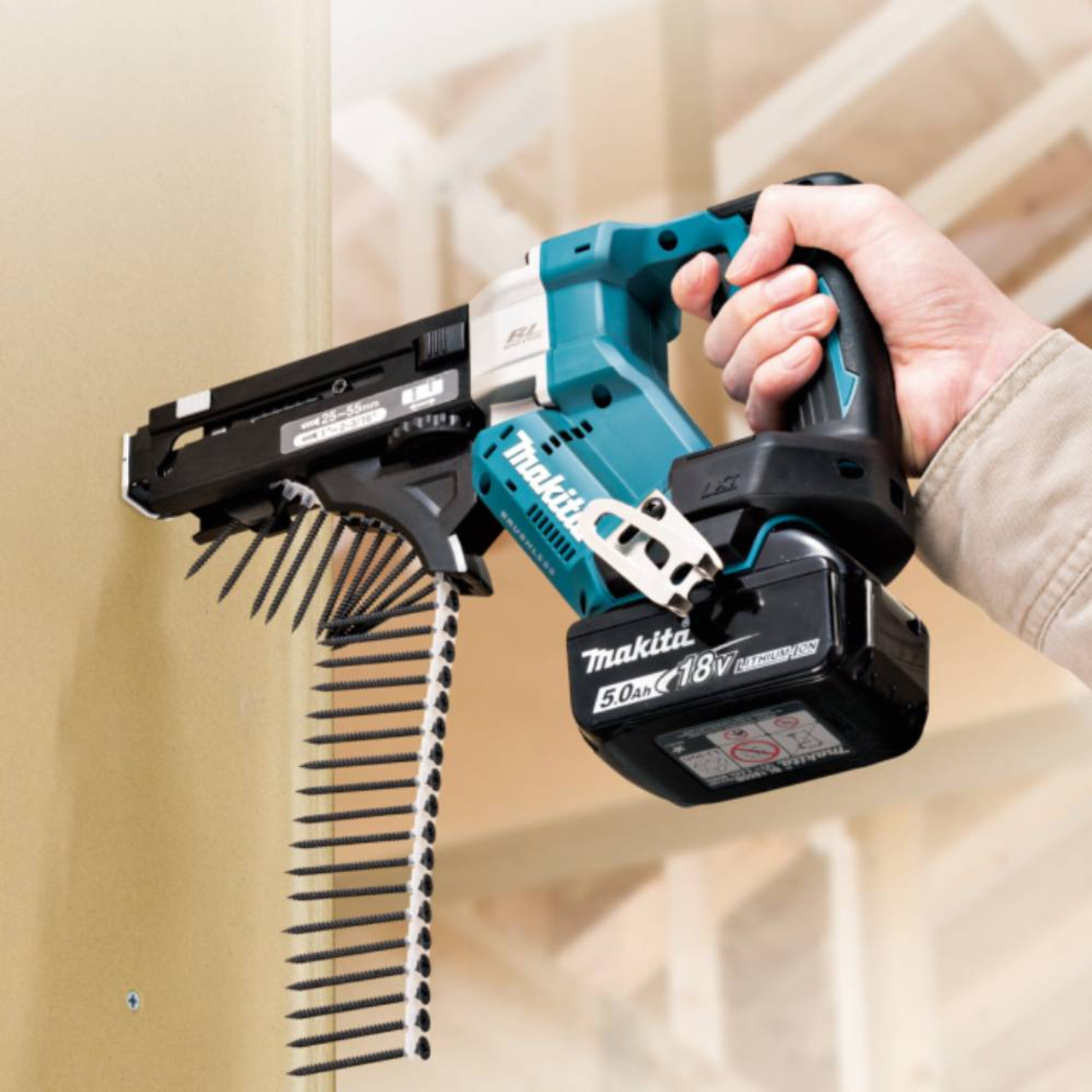 Makita DFR551ZX1 18V LXT Brushless 2-3/16in Autofeed Screwdriver (Tool Only) showing in use attaching a wood panel to studs (Battery are sold separately) Makita DFR551ZX1 18V LXT Brushless 2-3/16in Autofeed Screwdriver (Tool Only) showing in use attaching a wood panel to studs (Battery are sold separately)