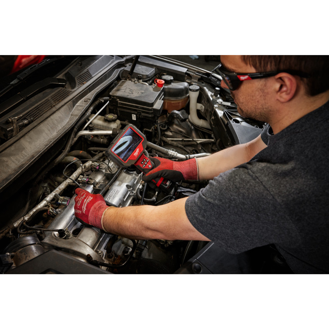 Milwaukee 3150-20 12V Auto Technician Borescope (Tool Only) showing in use looking down into