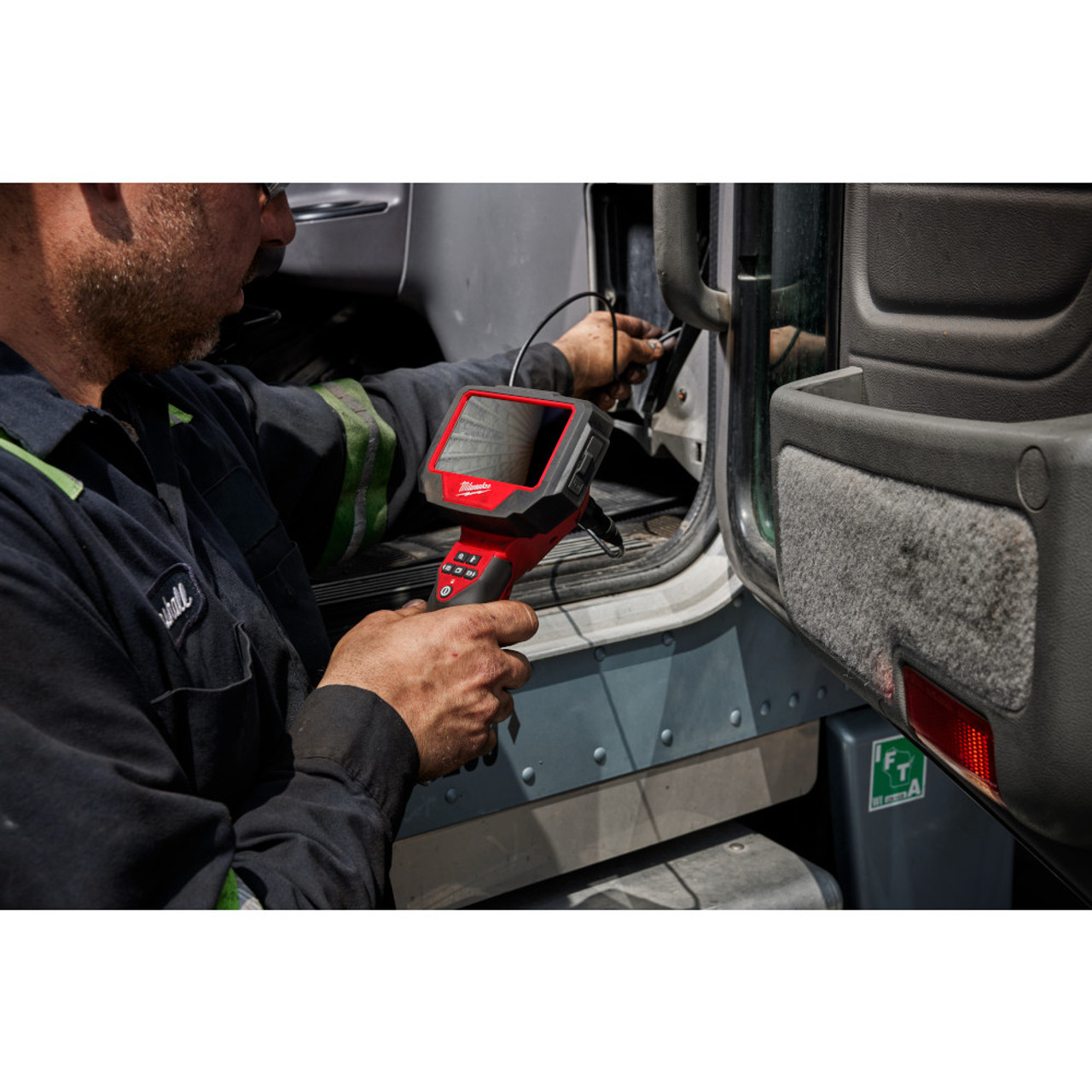 Milwaukee 3150-20 12V Auto Technician Borescope (Tool Only) showing in use looking behind the the front dash panel