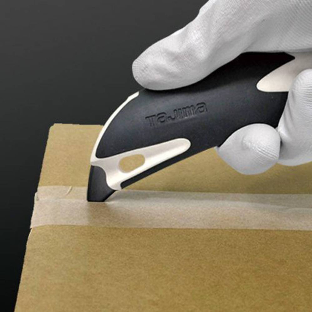 Tajima Premium DFC561N Cutter Series 560 Utility Knife with Dial Lock showing in use cutting open a box