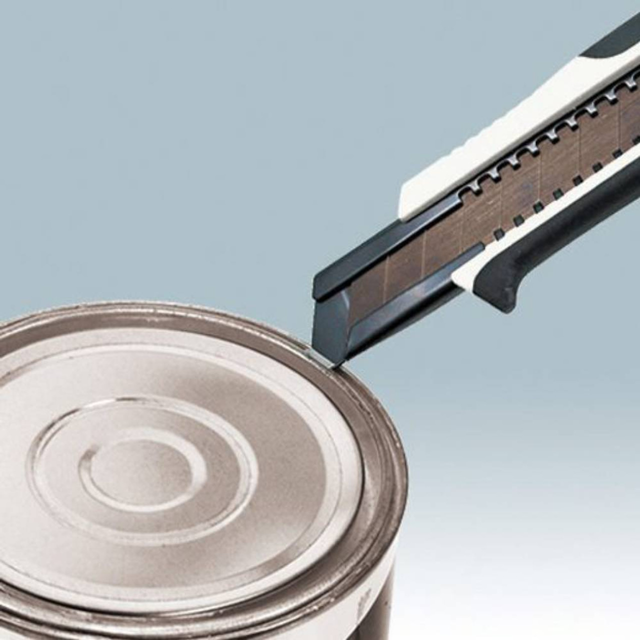 Tajima Premium DFC561N Cutter Series 560 Utility Knife with Dial Lock showing in use prying open a paint can with the pry tip