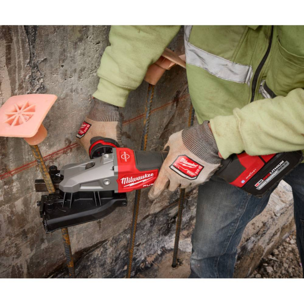 Milwaukee 3675-20 M18 FUEL Cordless Brushless #10 (1-1/4 inch) Rebar Cutter (Tool Only) showing in use cutting rebar close to a wall