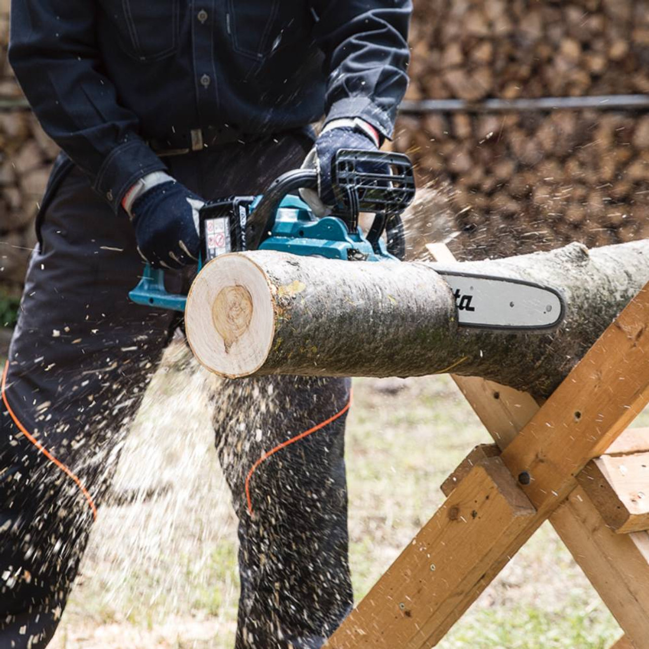 Makita DUC400Z 18Vx2 LXT 16 inch Brushless Rear Handle Chainsaw (Tool Only) showing in use cutting a log while sitting on a stand (Battery sold separately) Makita DUC400Z 18Vx2 LXT 16 inch Brushless Rear Handle Chainsaw (Tool Only) showing in use cutting a log while sitting on a stand (Battery sold separately)
