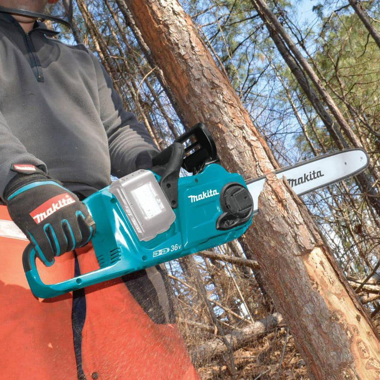 Makita DUC400Z 18Vx2 LXT 16 inch Brushless Rear Handle Chainsaw (Tool Only) showing in use cutting down a tree (Battery sold separately) Makita DUC400Z 18Vx2 LXT 16 inch Brushless Rear Handle Chainsaw (Tool Only) showing in use cutting down a tree (Battery sold separately)