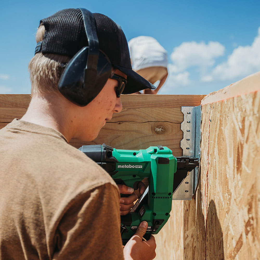 Metabo HPT NR1838DKAM 18V MultiVolt Cordless Brushless 1-1/2in Metal Connector Nailer Kit showing in use nailing a floor joist to a wood beam