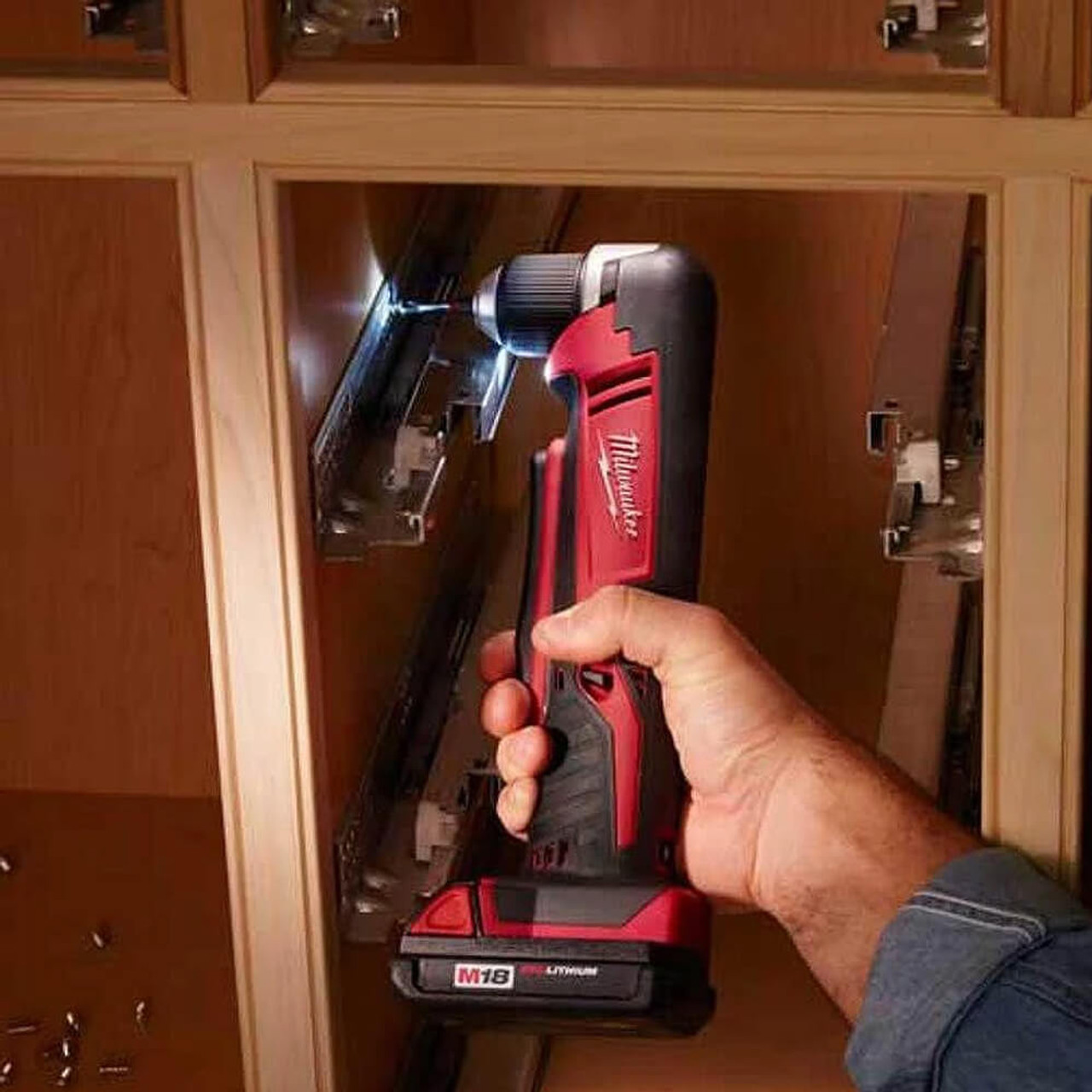 Milwaukee 2615-20 M18 Right Angle Drill drilling in cabinet (battery sold separately) Milwaukee 2615-20 M18 Right Angle Drill drilling in cabinet (battery sold separately)