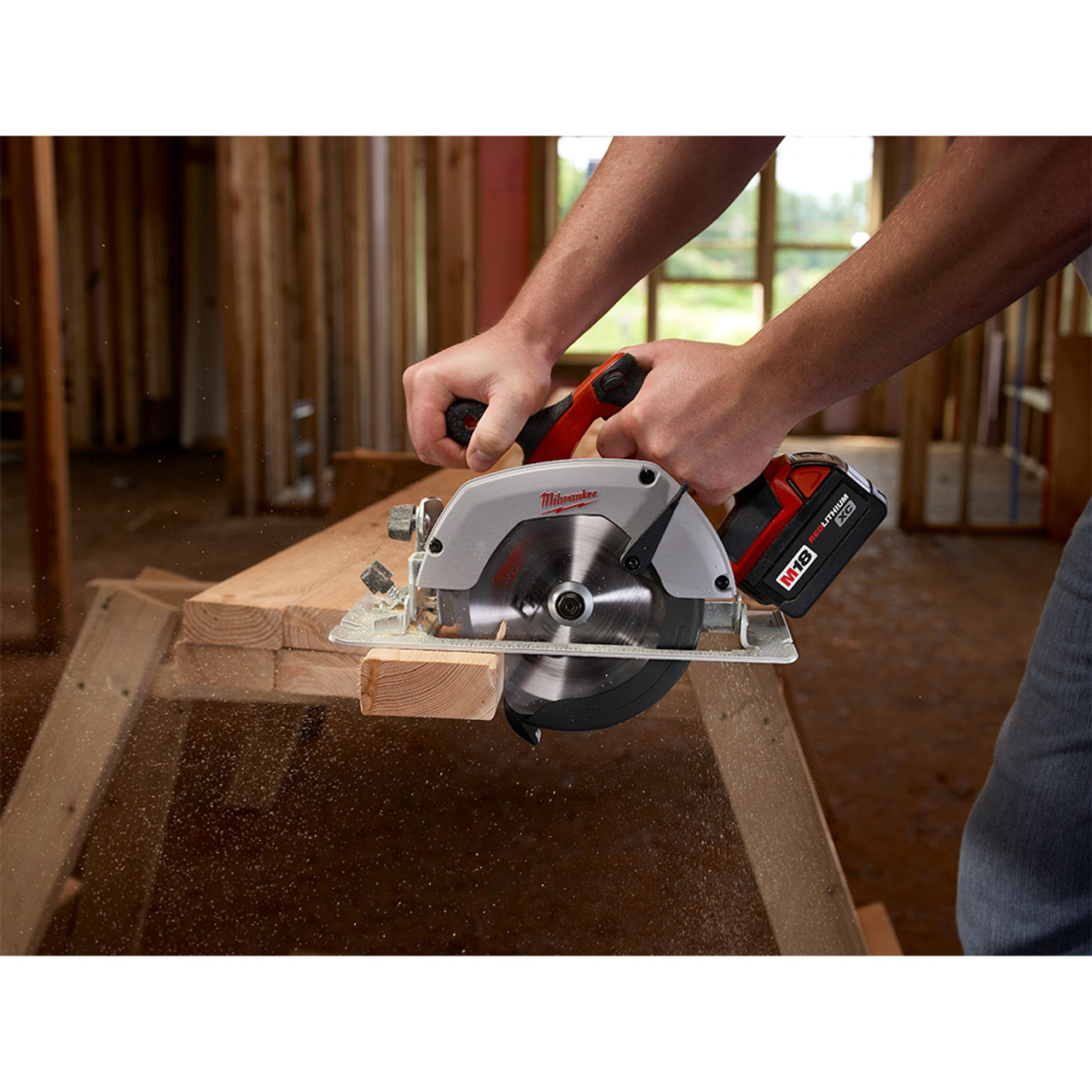 Milwaukee 2630-20 M18 6-1/2 inch Circular Saw  cutting wood plank (battery sold separately) Milwaukee 2630-20 M18 6-1/2 inch Circular Saw  cutting wood plank (battery sold separately)