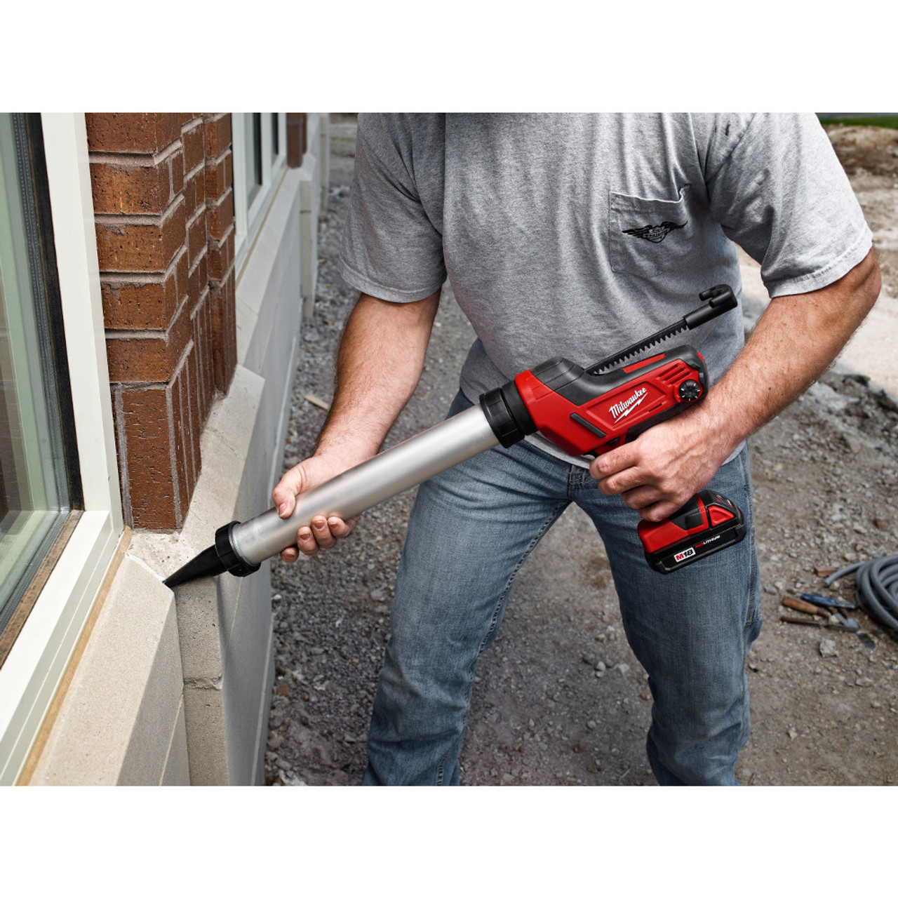 Milwaukee 2641-20 M18 10oz Caulk and Adhesive Gun applying caulking (battery sold separately)