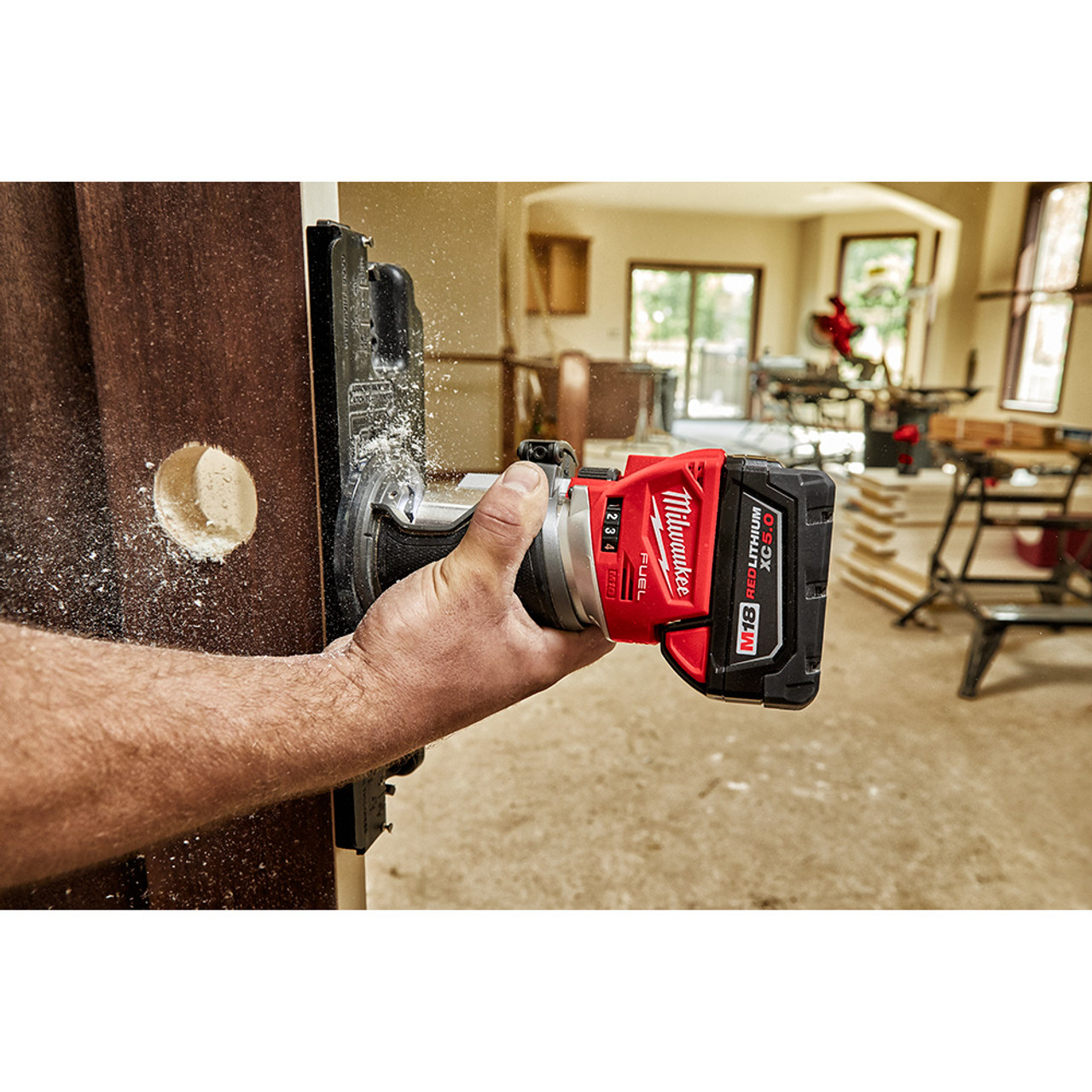 Milwaukee 2723-20 M18 FUEL Compact Router cutting wood (battery sold separately) Milwaukee 2723-20 M18 FUEL Compact Router cutting wood (battery sold separately)