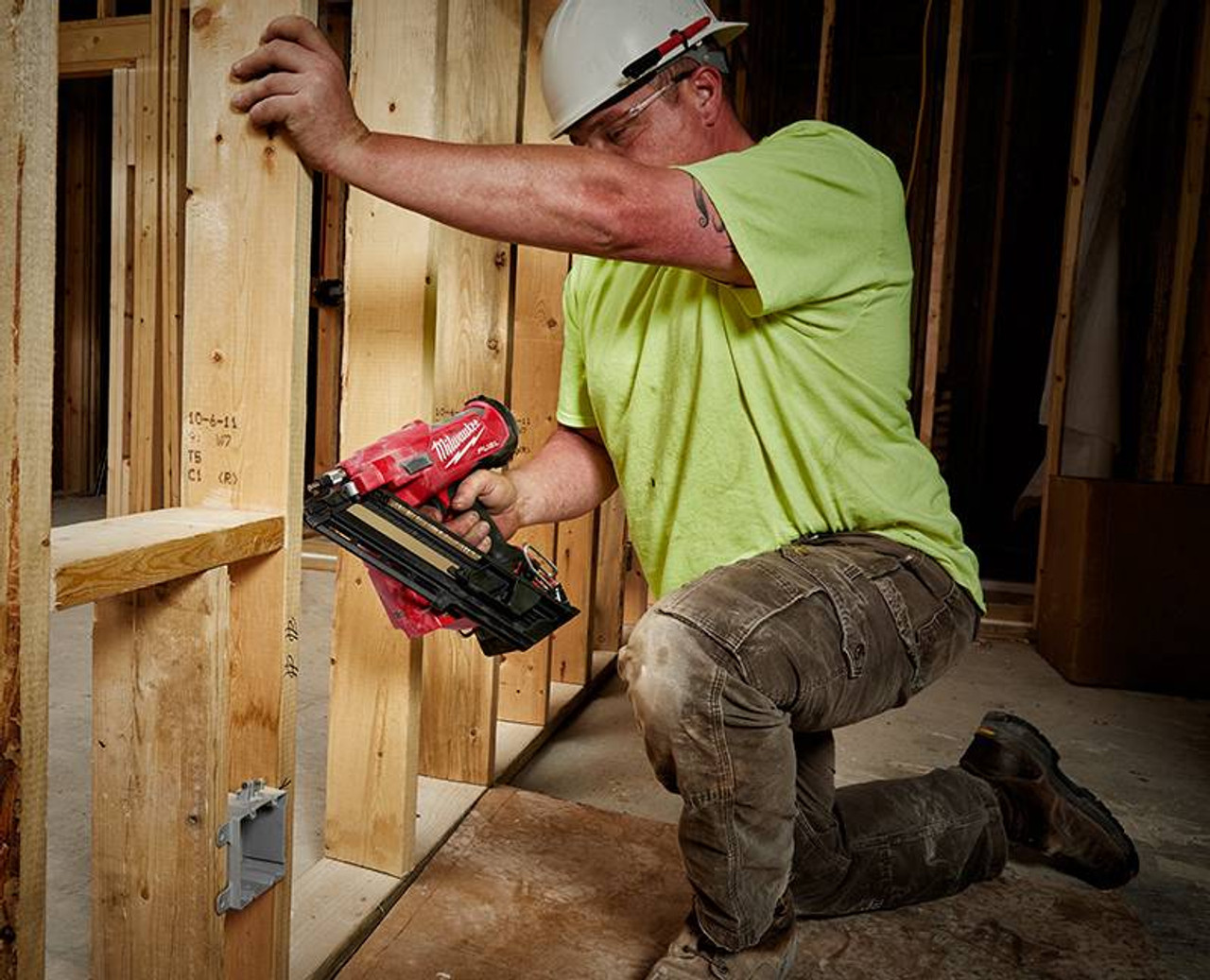 Milwaukee 2745-20 M18 FUEL 30 degree Framing Nailer driving in nails into wood frame (battery sold separately) Milwaukee 2745-20 M18 FUEL 30 degree Framing Nailer driving in nails into wood frame (battery sold separately)