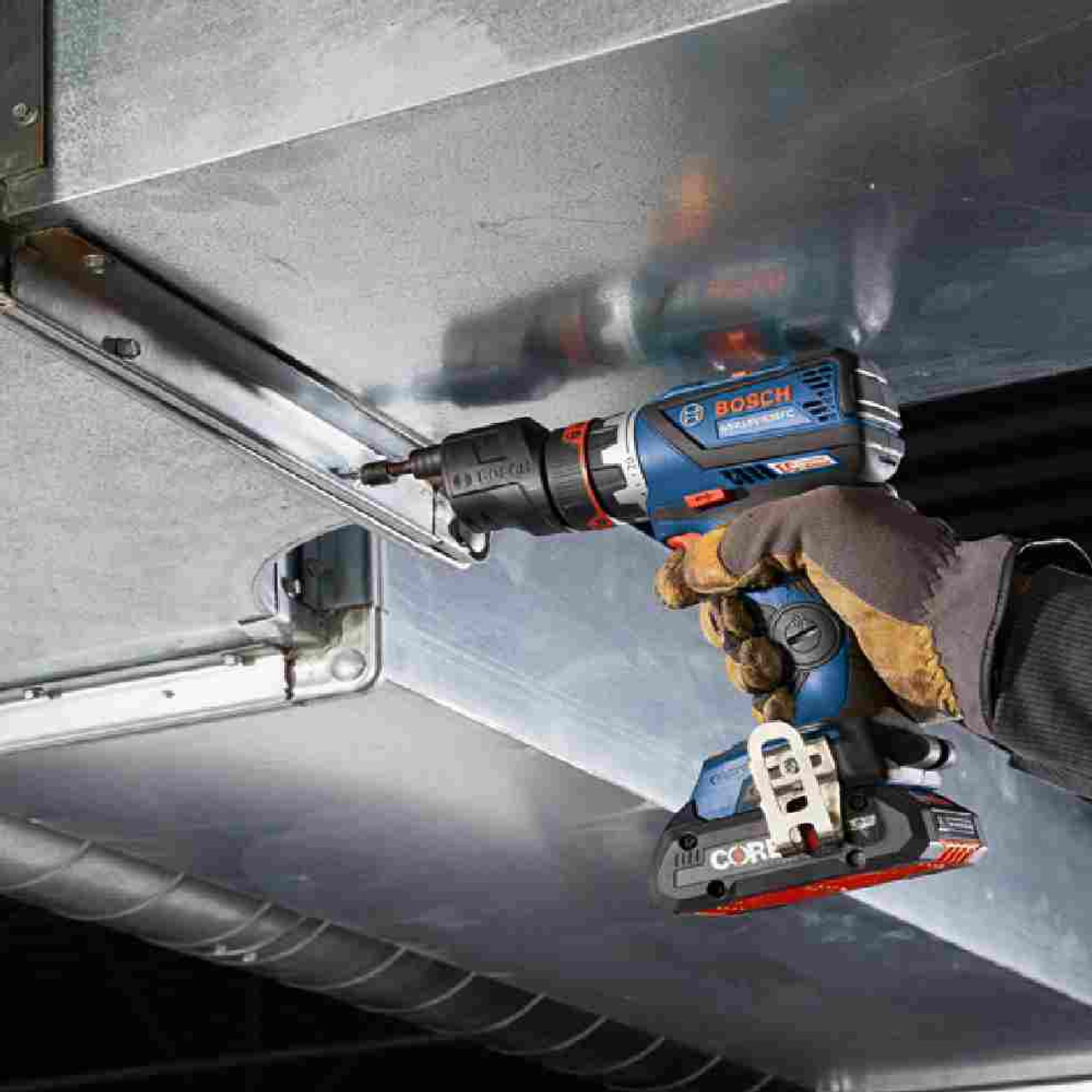 Bosch GSR18V-535FCB15 18V Cordless Chameleon Drill / Driver Kit with 5-In-1 Flexiclick System using offset heads drilling a hole is metal Bosch GSR18V-535FCB15 18V Cordless Chameleon Drill / Driver Kit with 5-In-1 Flexiclick System using offset heads drilling a hole is metal