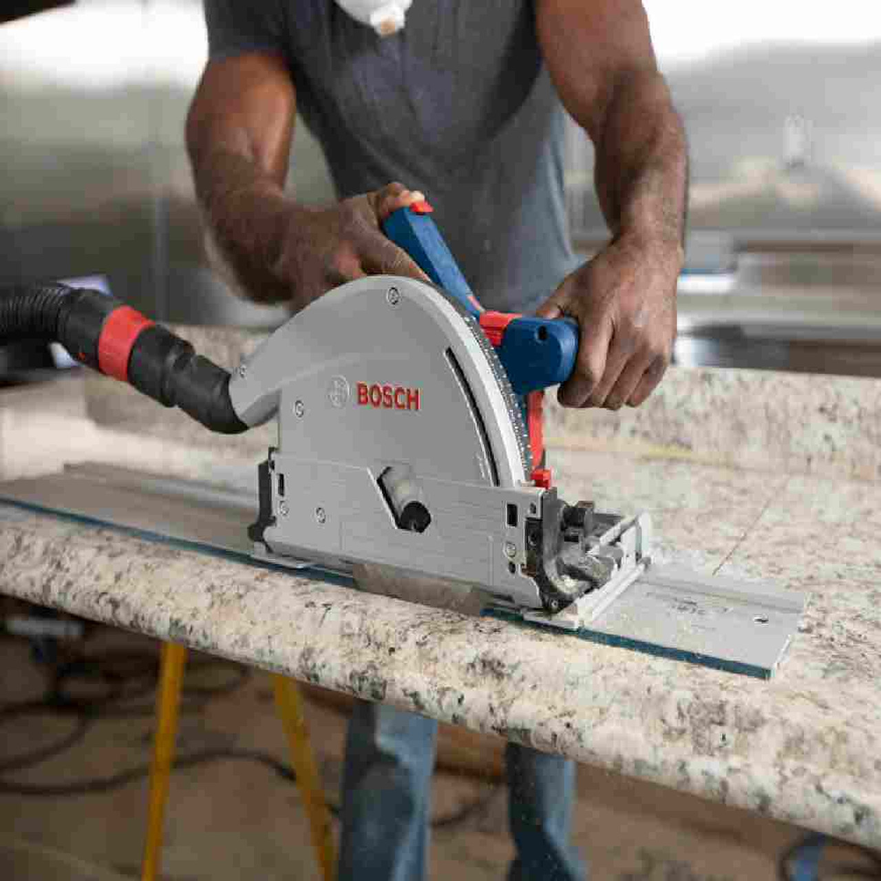 Bosch GKT18V-20GCL PROFACTOR 18V Cordless Connected-Ready 5-1/2 inch Track Saw (Tool Only) showing with track and cutting a counter top