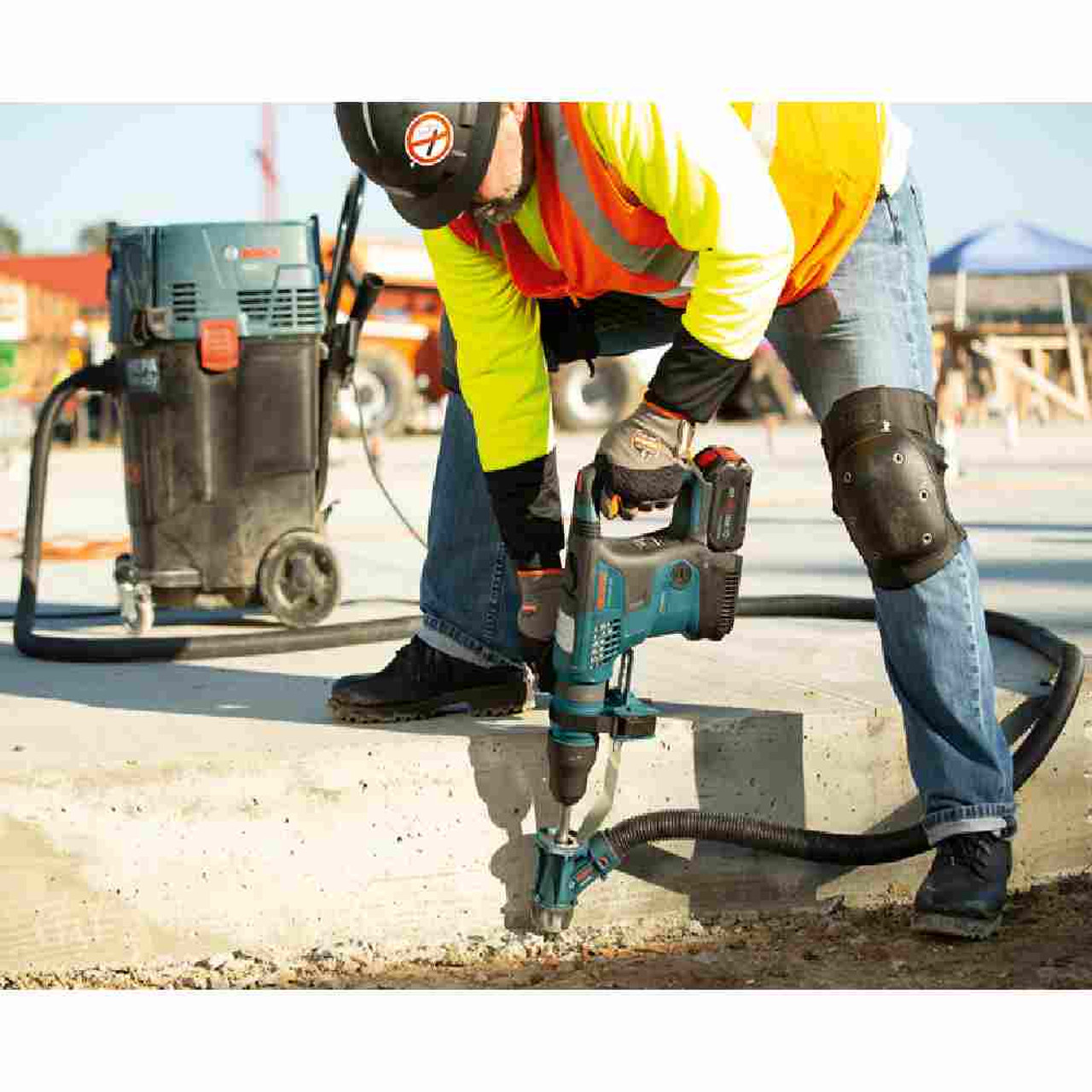 Bosch GBH18V-36CN 18V PROFACTOR Hitman Connected-Ready SDS-Max 1-9/16 inch Rotary Hammer (Tool Only) showing vertical drilling with dust execrator and vacuum (Sold Separately)