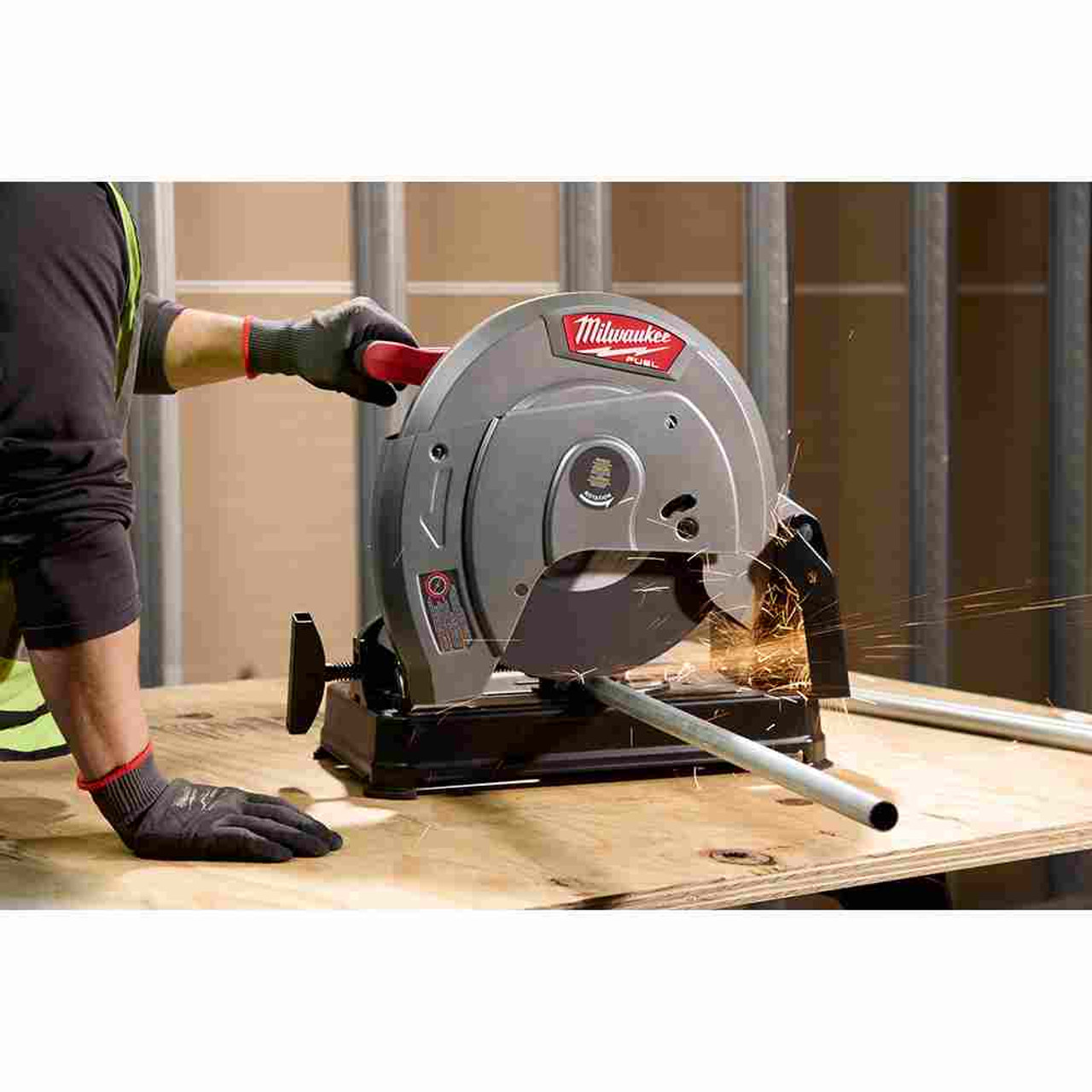 Milwaukee 2990-20 M18 FUEL 14 inch Brushless Abrasive Chop Saw (Tool Only) showing the saw cutting round metal tubing Milwaukee 2990-20 M18 FUEL 14 inch Brushless Abrasive Chop Saw (Tool Only) showing the saw cutting round metal tubing