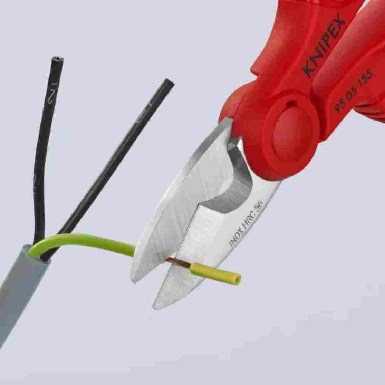 Knipex 9505155SBA 6-1/4 inch Electricians' Shears showing cutting small wire Knipex 9505155SBA 6-1/4 inch Electricians' Shears showing cutting small wire