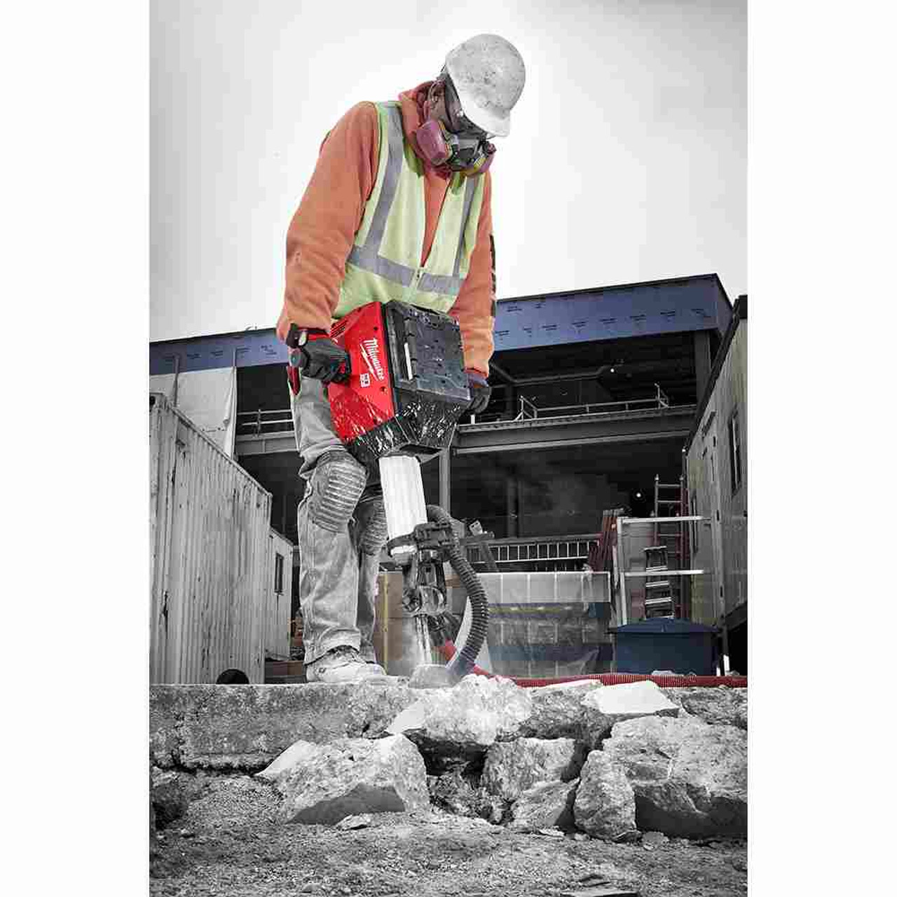 Milwaukee MXF368-1XC MX FUEL Cordless Demolition Breaker Kit showing in use breaking up a slab of concrete