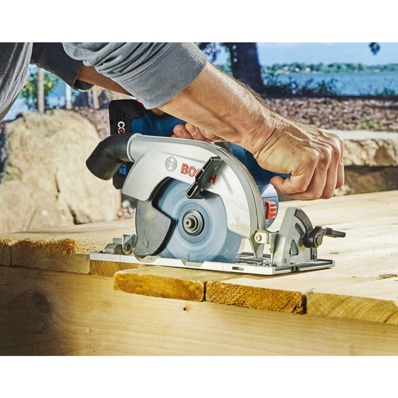 Bosch GKS18-22N 18V Cordless Brushless 6-1/2 inch Blade-Right Circular Saw (Tool Only) showing saw in use cutting lumber on jobsite