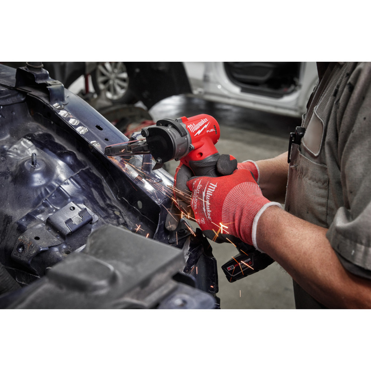 Milwaukee 2482-20 M12 FUEL Cordless Brushless 1/2 inch x 18 inch Bandfile (Tool Only) showing in use grinding metal joints