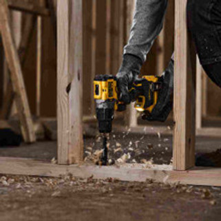 DeWalt DCD805B 20V MAX XR Brushless Cordless 1/2 Inch Hammer Drill/Driver (Tool Only) showing in use drilling a hole in wood stud with self feed bit (battery sold separately) DeWalt DCD805B 20V MAX XR Brushless Cordless 1/2 Inch Hammer Drill/Driver (Tool Only) showing in use drilling a hole in wood stud with self feed bit (battery sold separately)