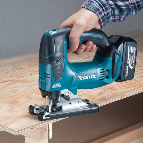 Makita DJV184Z 18V LXT Cordless Brushless Jig Saw with D-Handle (Tool Only) showing in use cutting plywood from a bench top