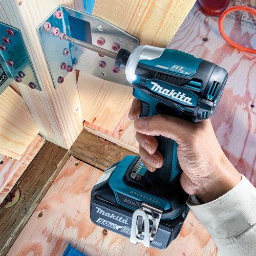 Makita DTD172Z 18V LXT Cordless Brushless 1/4 inch Impact Driver (Tool Only) showing in use fastening a screw through a bracket into wooden post