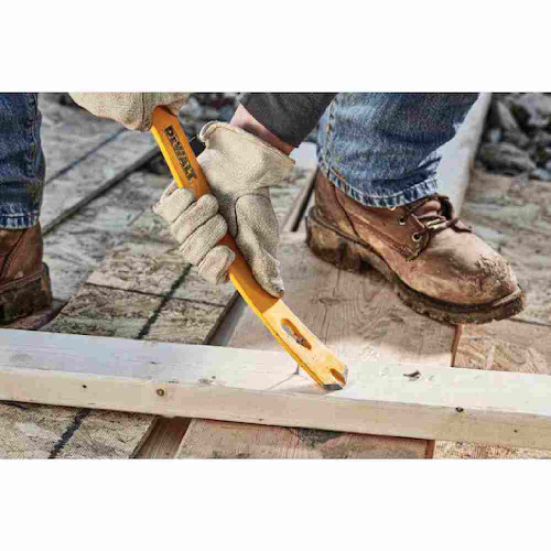 DeWalt DWHT55160 15 inch Spring Steel Flat Bar showing in use prying a nail holding two pieces of lumber together