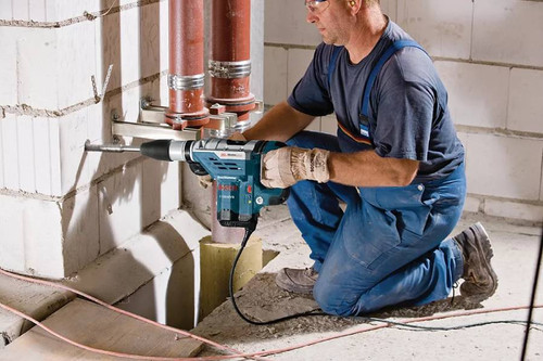 Bosch 11264EVS SDS-Max 1-5/8 inch Combination Hammer Drill on the job drilling a cement wall