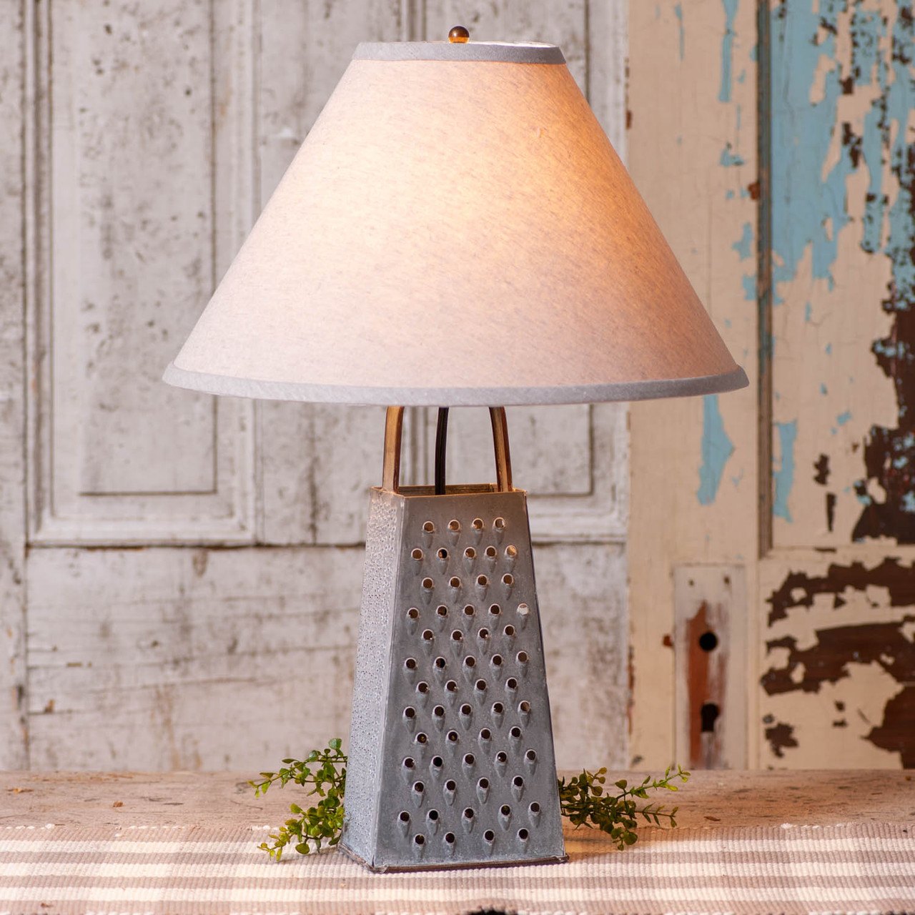https://cdn11.bigcommerce.com/s-dwlxj/images/stencil/1280x1280/products/4415/9296/K19-46A-irvins-tinware-grater-lamp-with-ivory-linen-shade__83768.1608771136.jpg?c=2