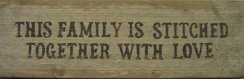 This Family Is Stitched Together With Love Wooden Sign
