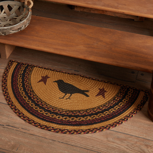 VHC Brands Heritage Farms Crow half circle braided jute rug, 16.5" x 33", mustard, black, burgundy, pictured at base of stairs.