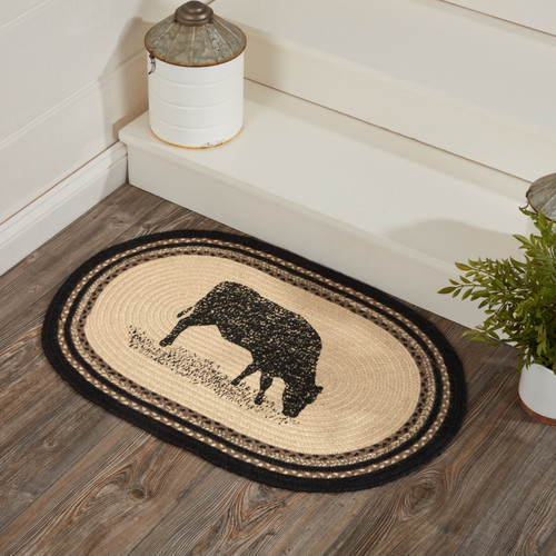 VHC Brands Sawyer Mill Charcoal Hog Print oval jute braided rug, 20" x 30", pictured at bottom of stairs.