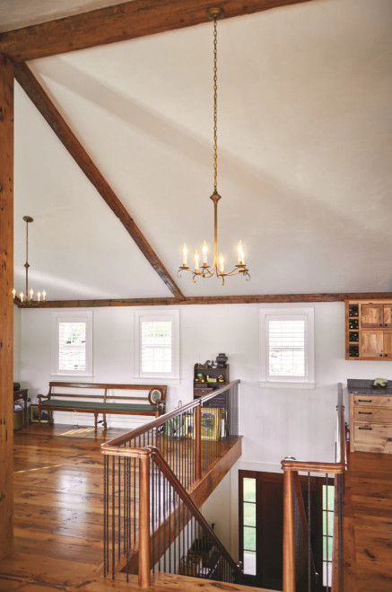 4 arm brass chandelier made in the USA by Northeast Lantern pictured in loft area