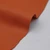 Rich orange full-grain leather hide with natural pebbled texture, ideal for crafting and upholstery projects.