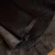 Rich dark brown leather hide with natural grain texture, ideal for crafting and upholstery projects.