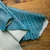 Embossed cowhide with croc texture – blue and black leather for belts and handbags