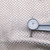 off white and silver woven leather hide