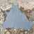 grey kangaroo hide on a textured concrete surface