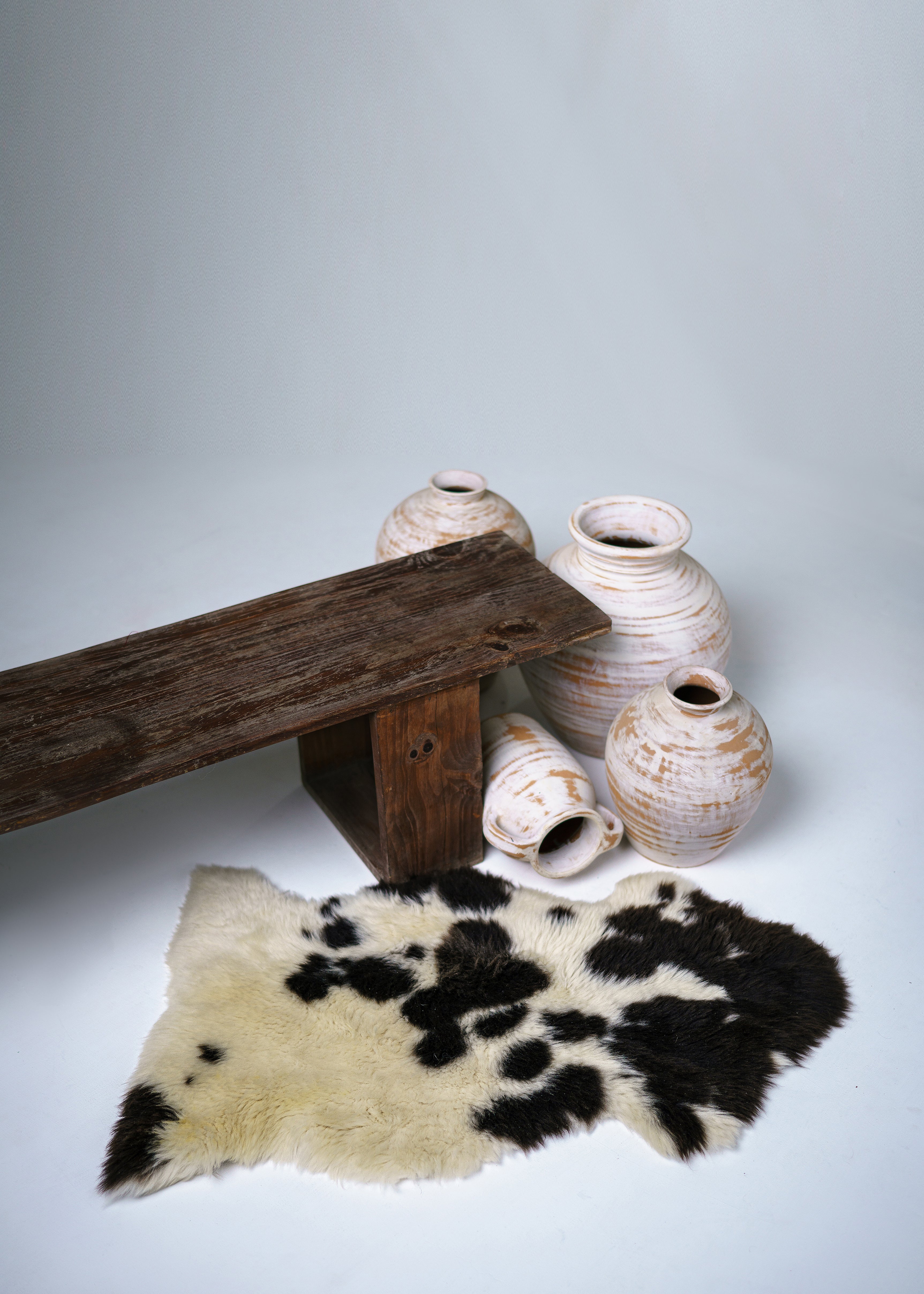 Two-tone sheep rug skin in cream and dark brown – soft sheepskin for living room or bedroom use