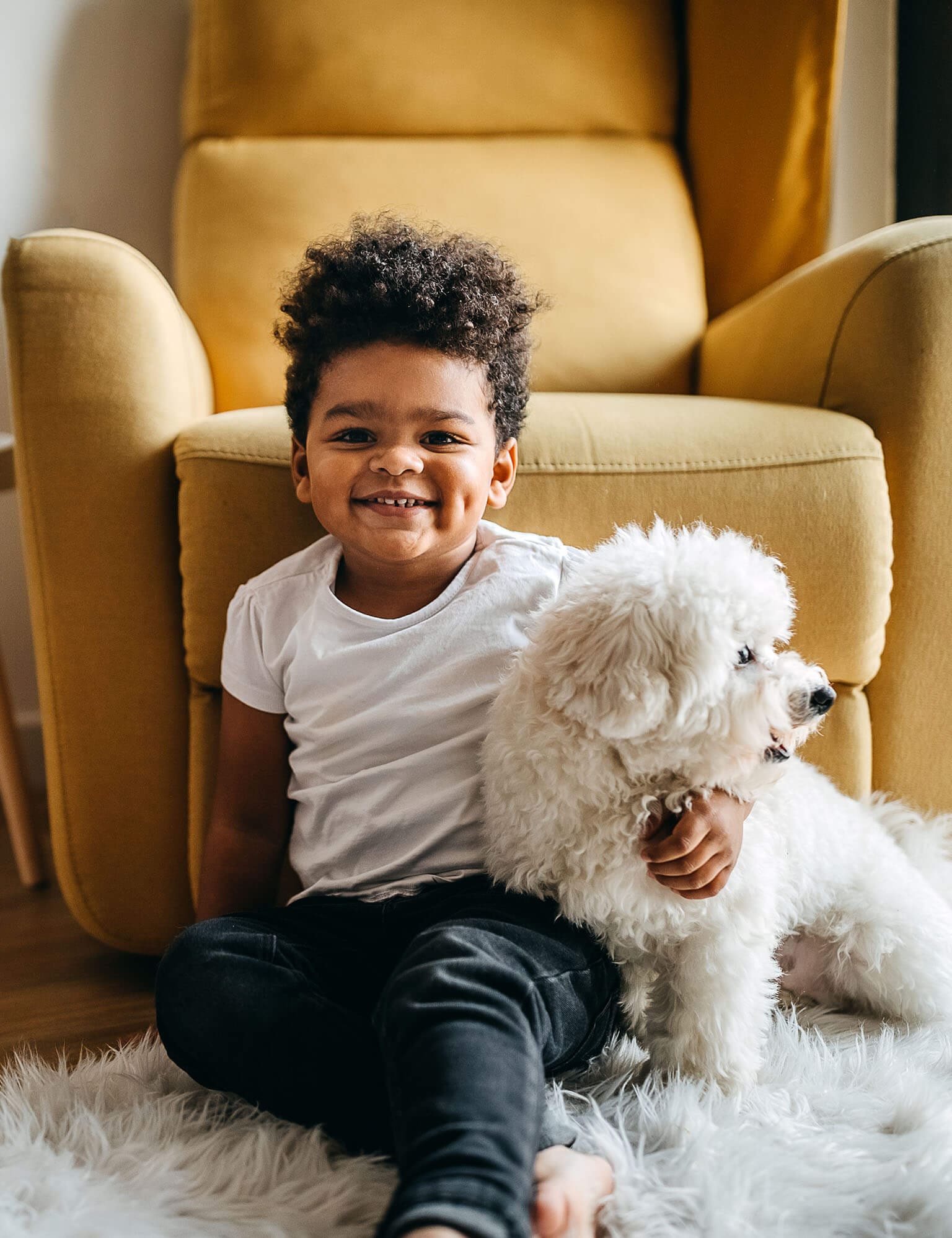 Happy boy hugging a dog